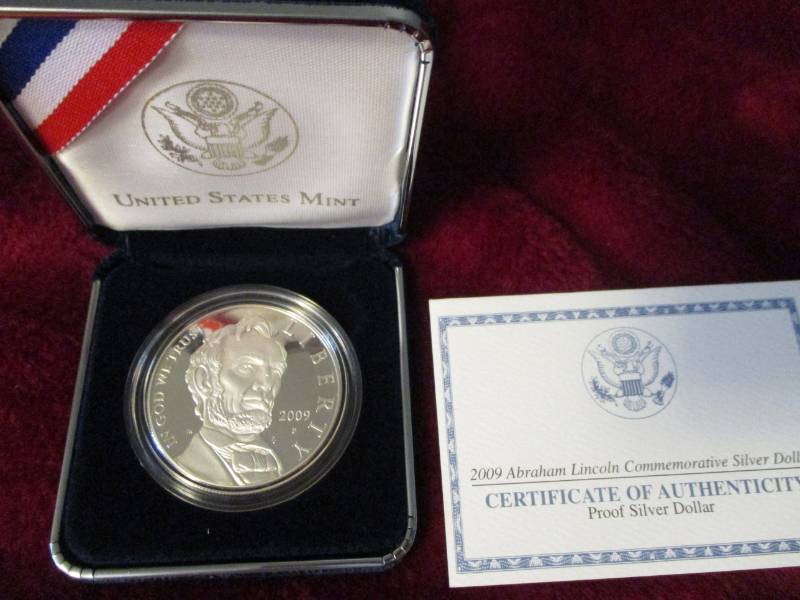 lot 220 image: 2009P Lincoln Commemorative Proof Silver Dollar 90% Silver