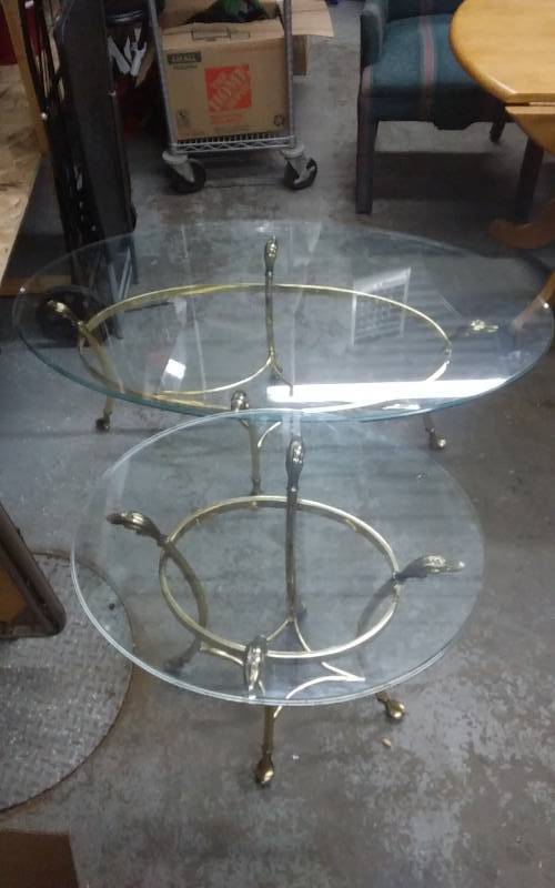 lot 26 image: 2 Brass Tone Oval Base Tables With Glass Tops