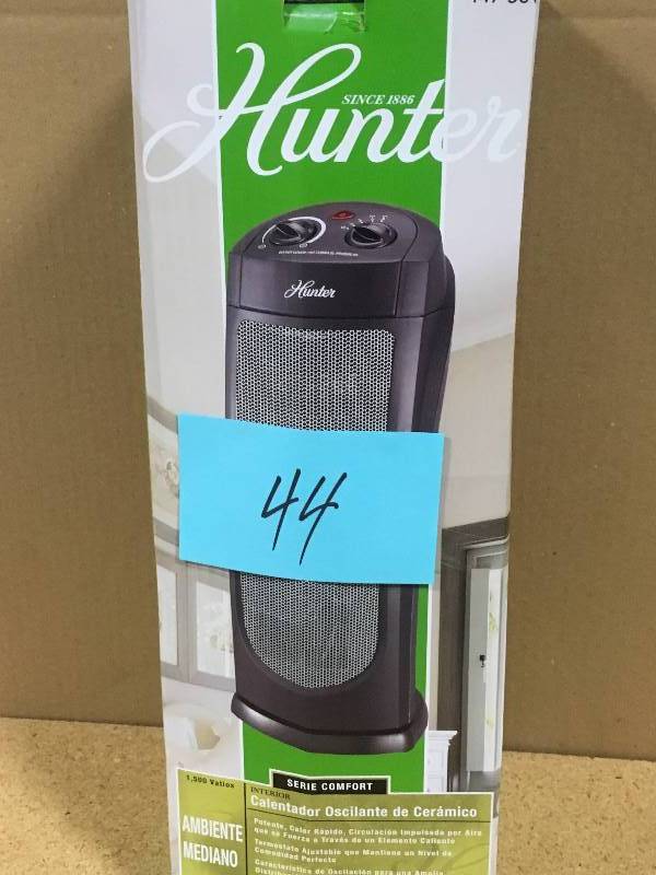 lot 44 image: Hunter 18.58 in. 1,500-Watt Oscillating Ceramic Tower Heater open box in like new condition