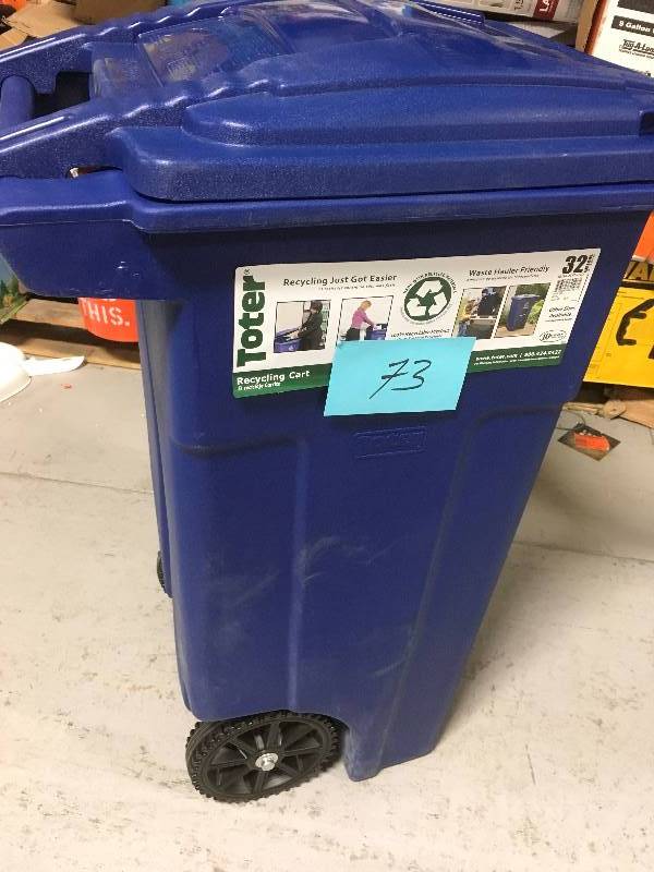 lot 73 image: Toter 32 Gal. Blue Rollout Recycling Container with Attached Lid open box in like new condition