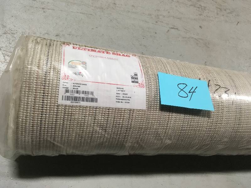 lot 84 image: Ottomanson Contemporary Solid Beige 7 ft. x 9 ft. Shag Area Rug not used