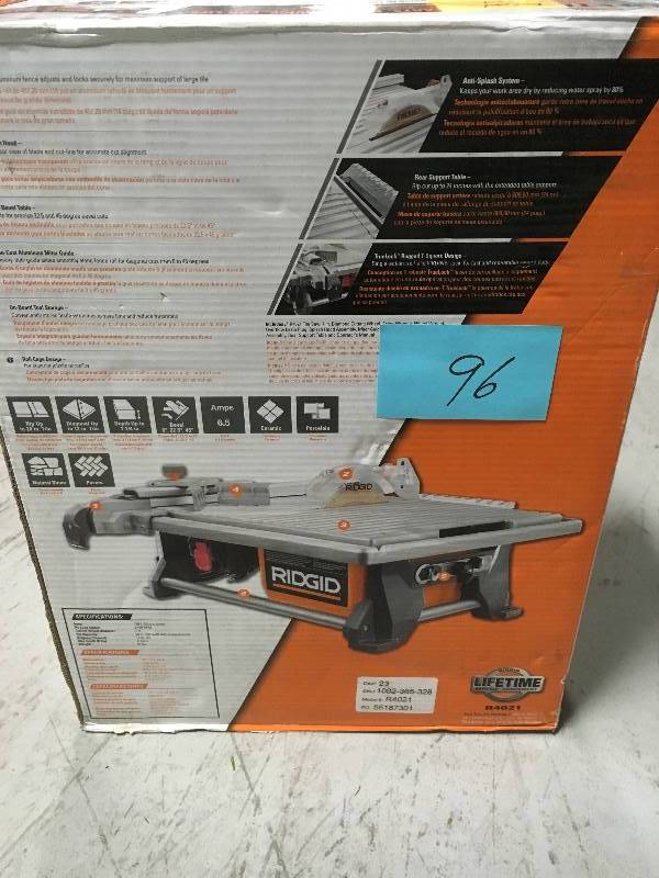 lot 96 image: RIDGID 6.5 Amp Corded 7 in. Table Top Wet Tile Saw USED in good condition