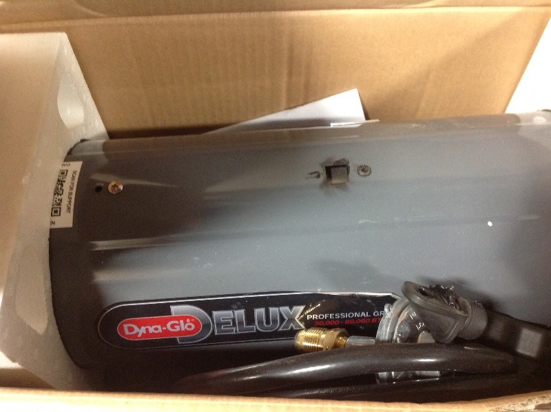 lot 114 image: Dyna-Glo Delux  30K-60K BTU LP Forced Air Propane Portable Heater in working conditions whit small damage on the handle