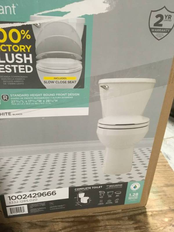lot 51 image: American Standard Reliant 2-piece 1.28 GPF Single Flush Round Toilet in White with Slow Close Seat open box in like new condition
