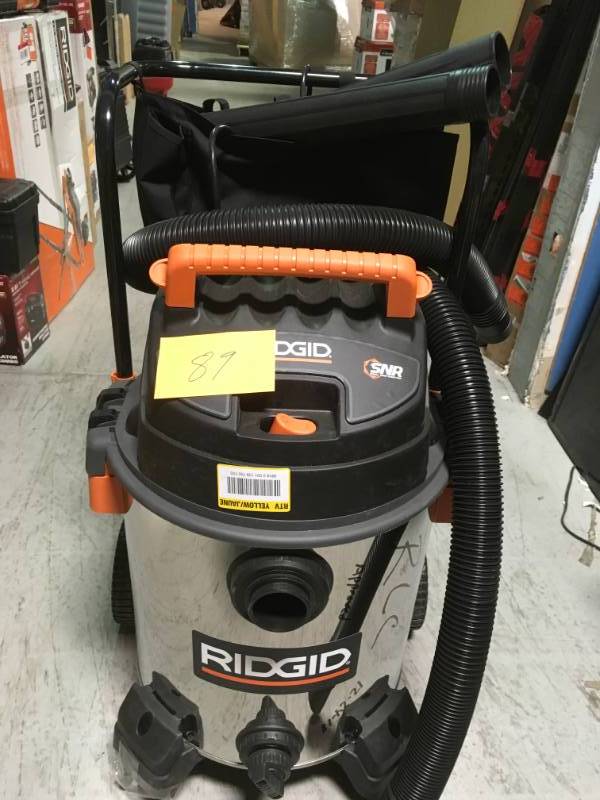 lot 89 image: RIDGID 16 Gal. 6.5-Peak HP Stainless Steel Wet Dry Vac BROKEN WHEEL AND DENT