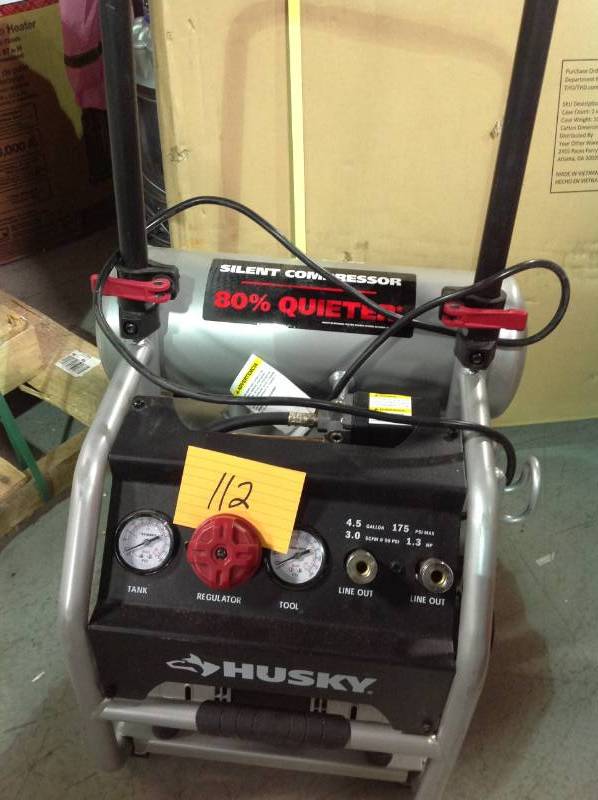lot 112 image: Husky 4.5 Gal. Portable Electric-Powered Silent Air Compressor in like new condition