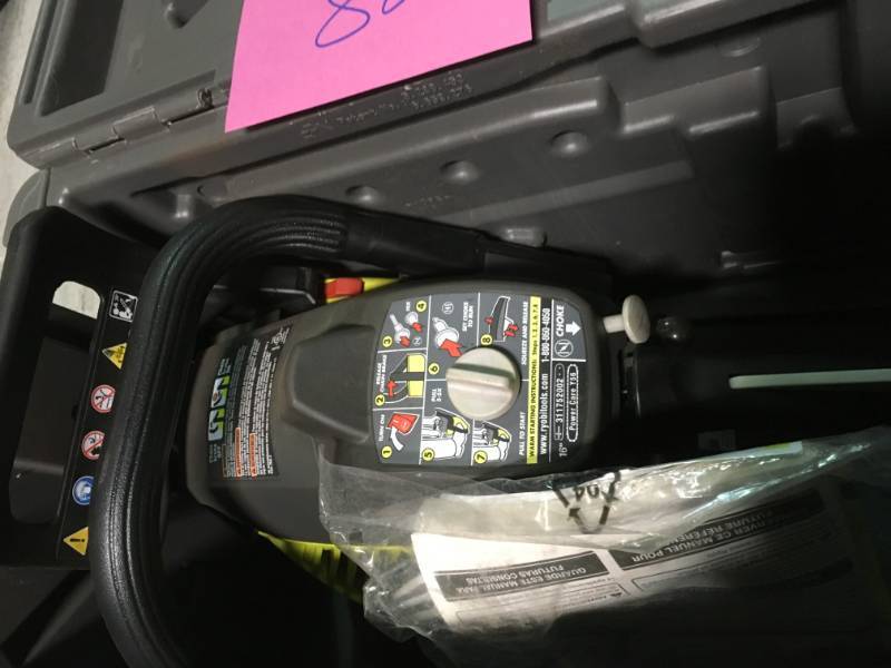 lot 82 image: RYOBI 16 in. 37cc 2-Cycle Gas Chainsaw with Heavy-Duty Case in like new condition