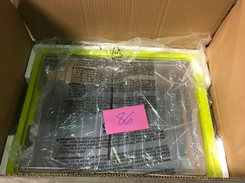 lot 86 image: RYOBI 7 in. 4.8 Amp Tabletop Tile Saw in like new condition