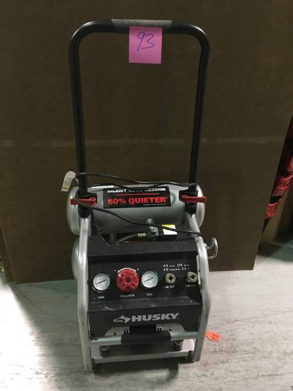lot 93 image: Husky 4.5 Gal. Portable Electric-Powered Silent Air Compressor in like new condition