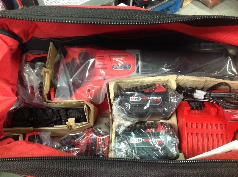 lot 104 image: Milwaukee M18 Cordless 3-Tool Combo Kit whit 2 xc 3.0 batteries not used