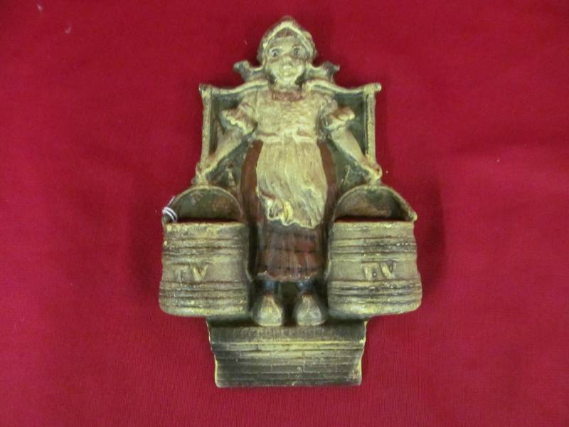 lot 34 image: vintage cast iron Dutch girl match holder