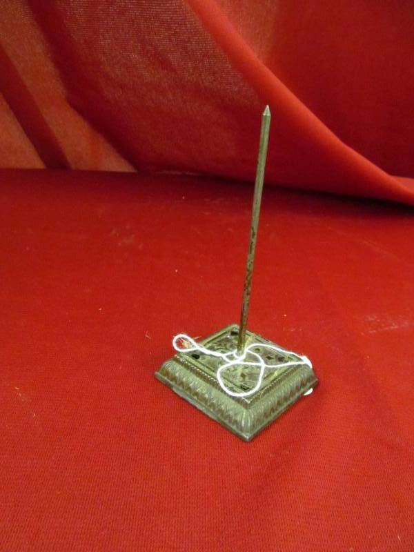 lot 115 image: vintage cast iron paper spindle