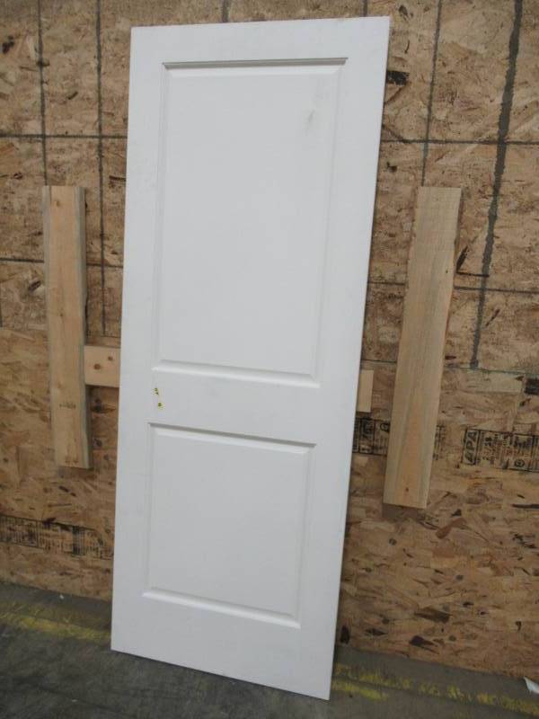 lot 55 image: Reliabilt EightDoors Shaker Primed White 2-Panel Square Solid Core MDF Slab Door (Common 30-in X 80-in) 70288014803035SH