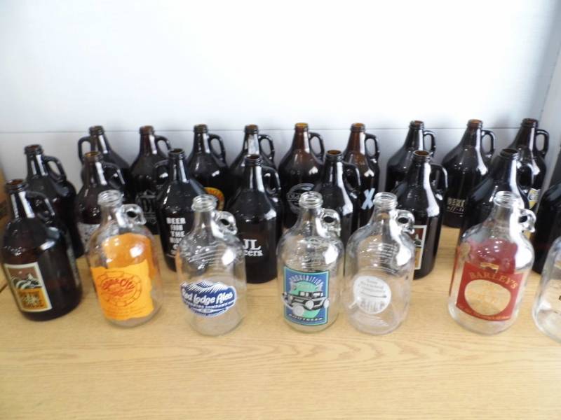 lot 24 image: Lot of 29 Beer Growlers
