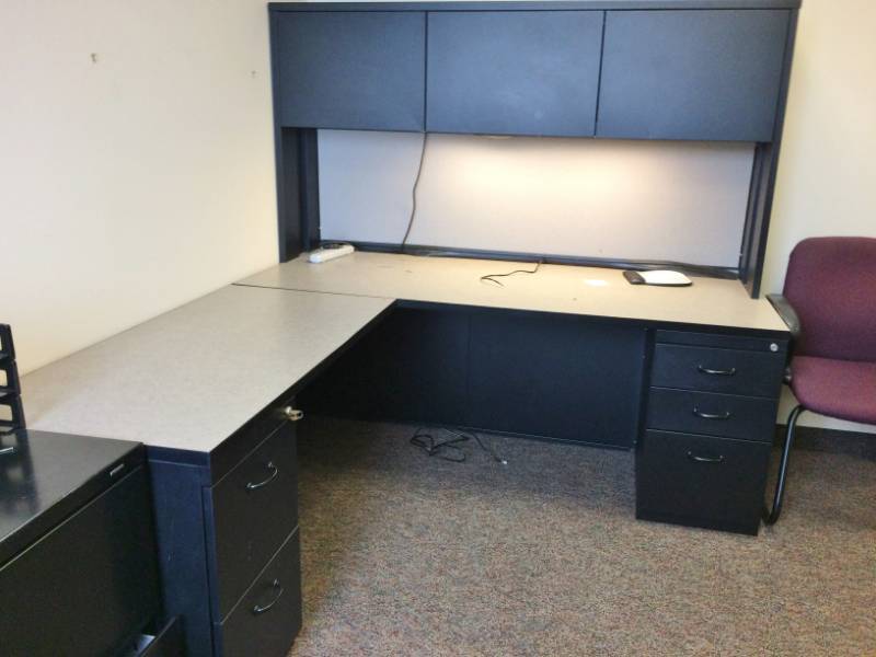 lot 30 image: MSRP $3000 High Quality Steelcase Executive Office Workstation Desk With Left Return, 1-3 Drawer Filing Cabinet, 1-2 Drawer Filing Cabinet, Lighted Overhead 4 Door Cabinets Sleek Chic BlackWhite Design Excellent Premium Condition With Key