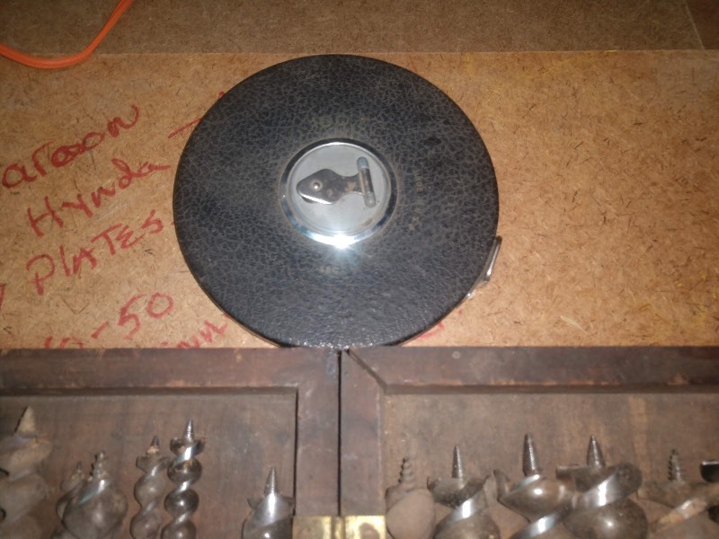 lot 9 image: Antique Drill Bit Set w Wooden Case and Vintage Reel Measuring Tape