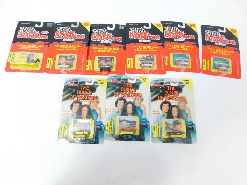 lot 29 image: Six 1144 Scale Die Cast Replicas With Collector Card & Display Stand & Three Dukes Of Hazard Special Episode Collection