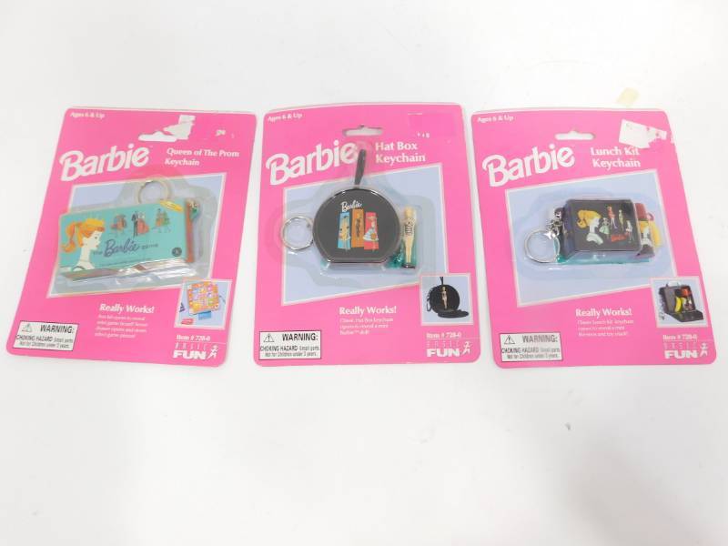 lot 63 image: Three Barbie Keychains
