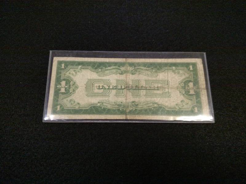 lot 103 image: 1934 Funny Back One Dollar Silver C...
