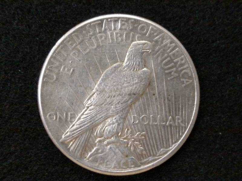 lot 23 image: 1925 Peace Silver Dollar...