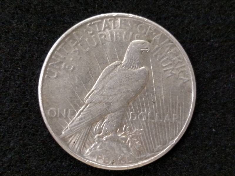lot 30 image: 1935 Peace Silver Dollar...