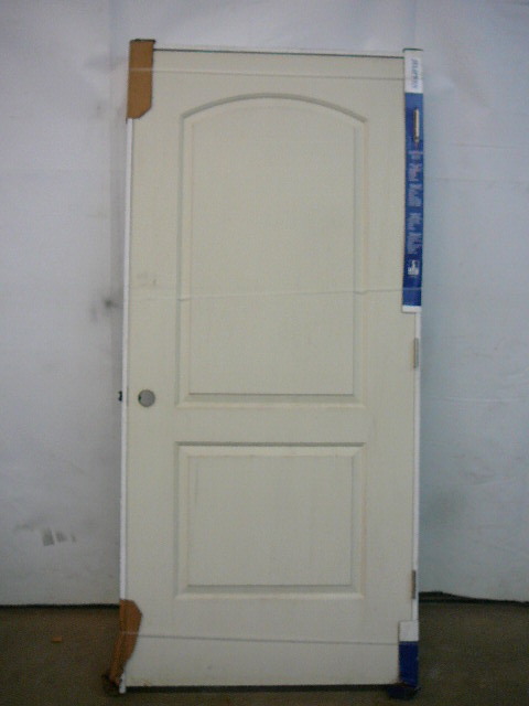 lot 71 image: Molded 2 Panel Arch Top Smooth Door