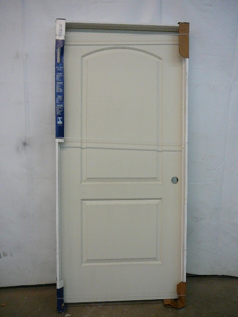 lot 72 image: Molded 2 Panel Arch Top Smooth Door