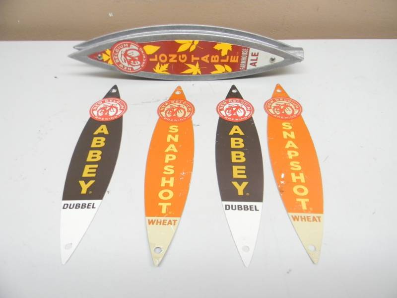 lot 36 image: NEW BELGIUM LONG TABLE TAP HANDLE WITH TWO EXTRA SETS OF CHANGEABLE INSERTS (SNAP SHOT & ABBEY) 11TALL - SEE PICTURES