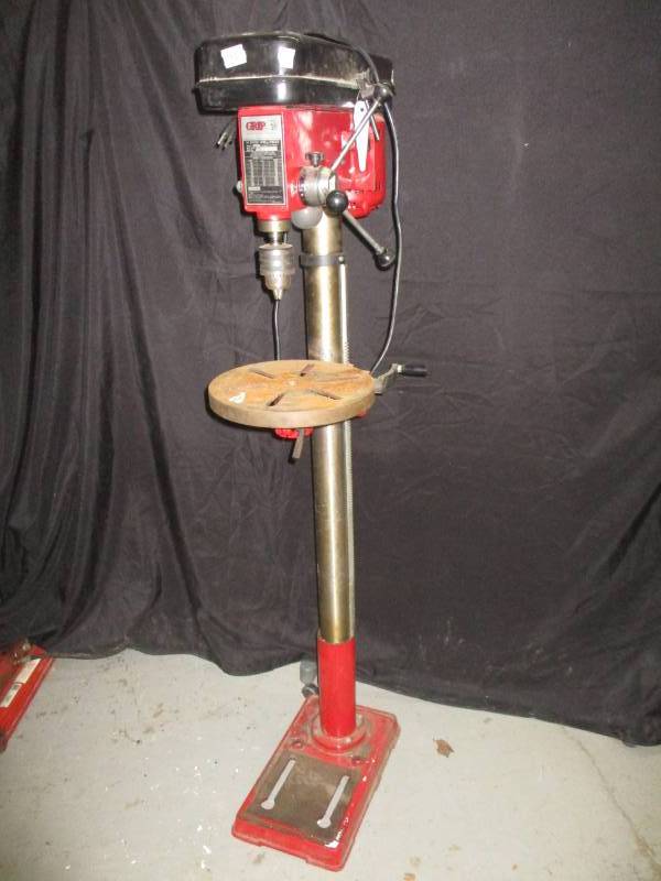 lot 1 image: Drill Press, 5 ft high adjustable height and barely used