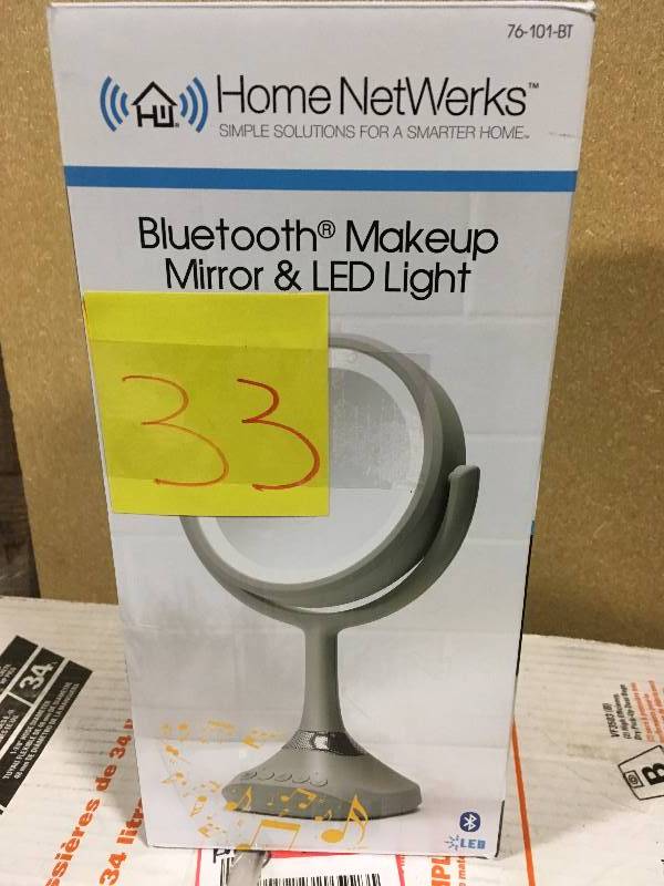 lot 33 image: Home Netwerks 6.25 in. x 12.5 in. Bi-view Bluetooth LED Handheld Makeup Mirror  in like new condition