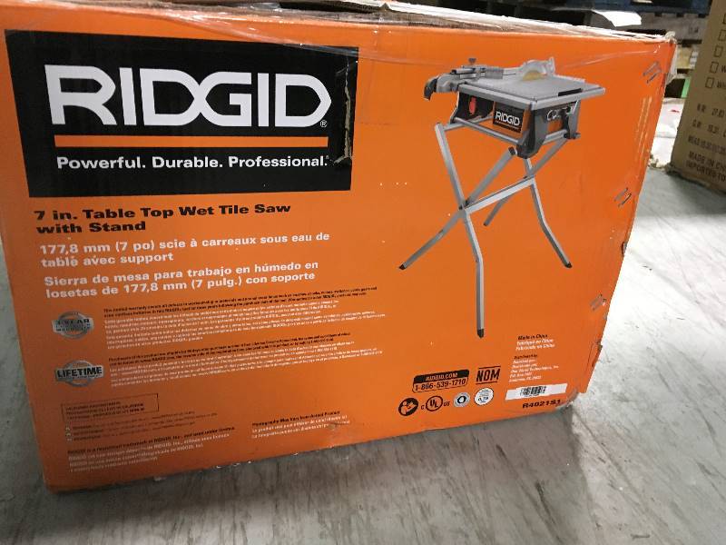 lot 67 image: RIDGID 120-Volt 7 in. Table Top Wet Tile Saw with Free Stand  in like new condition