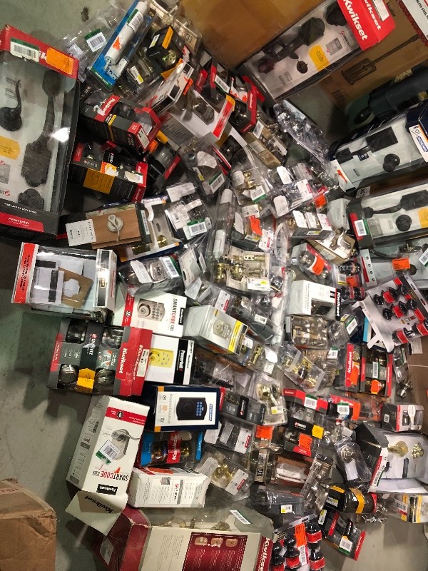 Lot of assorted door hardware regular and smart models open packages