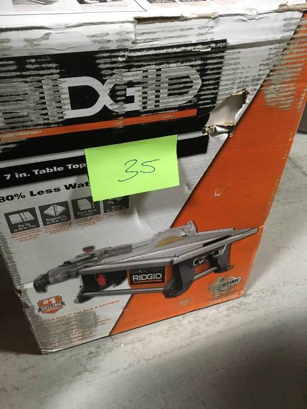 lot 35 image: RIDGID 6.5 Amp Corded 7 in. Table Top Wet Tile Saw USED in good condition