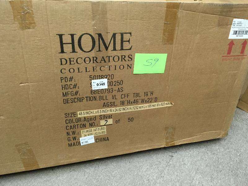 lot 59 image: Home Decorators Collection Bella Aged Silver Oval Glass Coffee Table in like new condition