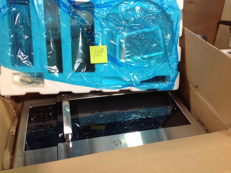 lot 107 image: GE  1.6 cu. ft. Over the Range Microwave in Stainless Steel  in good conditions