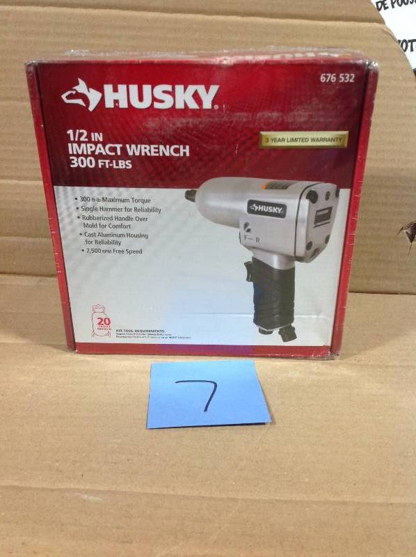 lot 7 image: Husky 12 in. 300 ft. lbs. Impact Wrench in like new condition