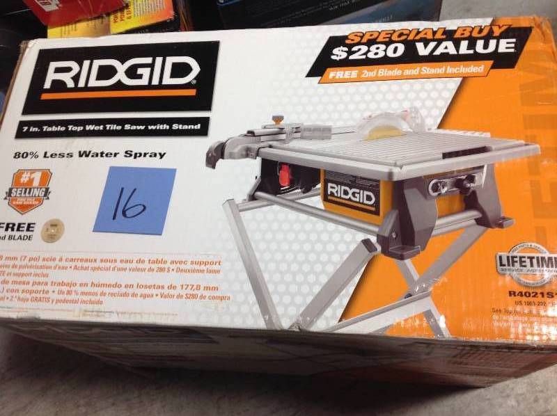 lot 16 image: RIDGID 120-Volt 7 in. Table Top Wet Tile Saw with Free Stand  in like new condition