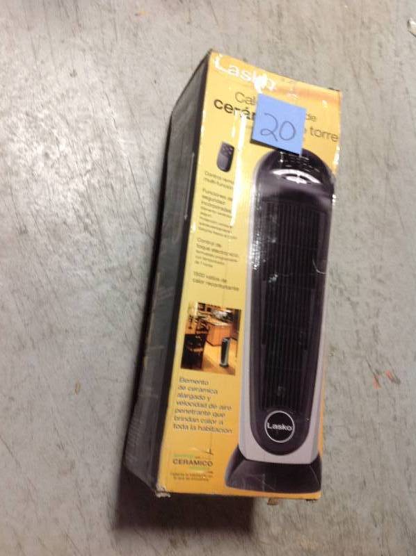 lot 20 image: Lasko 23 in. 1500-Watt Electric Portable Ceramic Tower Heater with Remote Control in like new condition