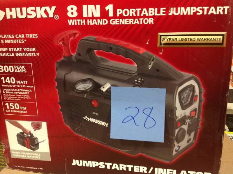 lot 28 image: Husky 8-in-1 12-Volt Power SourceJumpstarter  in like new condition