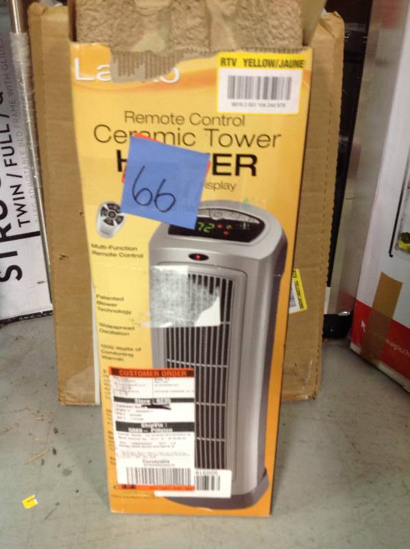 lot 66 image: Lasko 23 in. 1500-Watt Ceramic Tower Heater with Digital Display  in like new condition