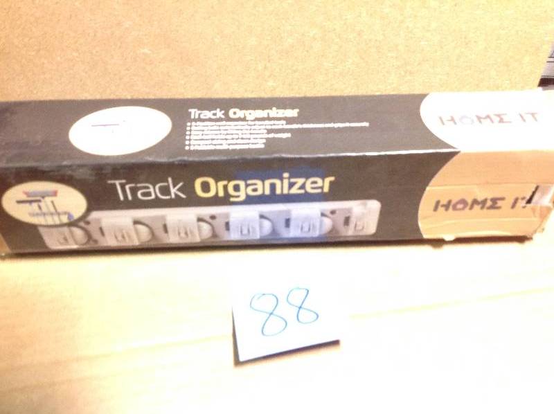 lot 88 image: Home it Mop and Broom Holder  in like new condition