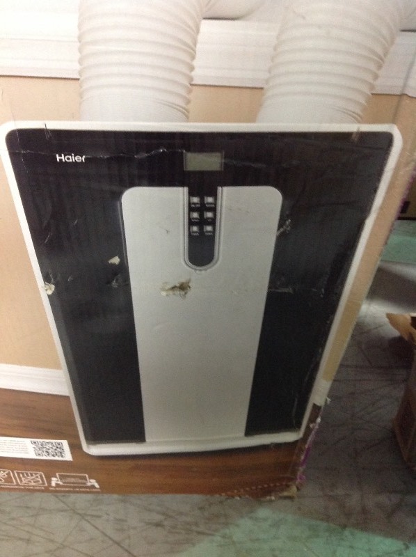 lot 105 image: Haier  14,000 BTU Cool and Heat Portable Air Conditioner with 110 pt. Per Day Moisture Removal in Dehumidification Mode  in good conditions