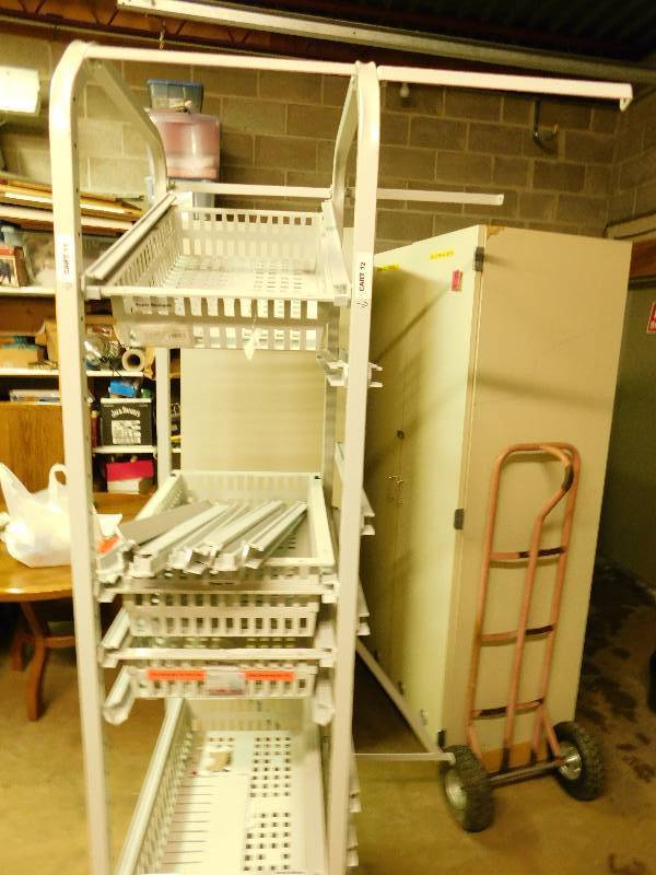 Grey Metal Stand On Wheels With Six Slide Out Trays Or Baskets