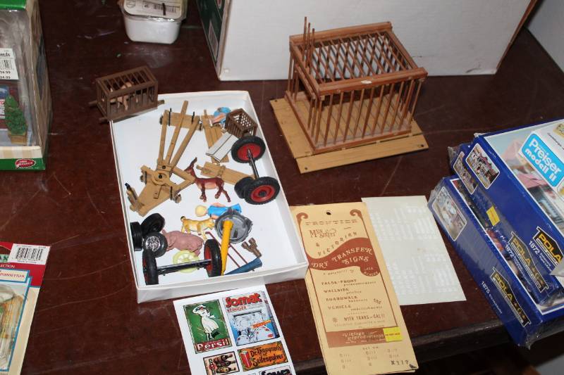 lot 316 image: G-Scale Train Accessories - Animals, Crates, Axles, Wood Panels, Fronteir Main Street & Victorian Dry Transfer Signs, And More