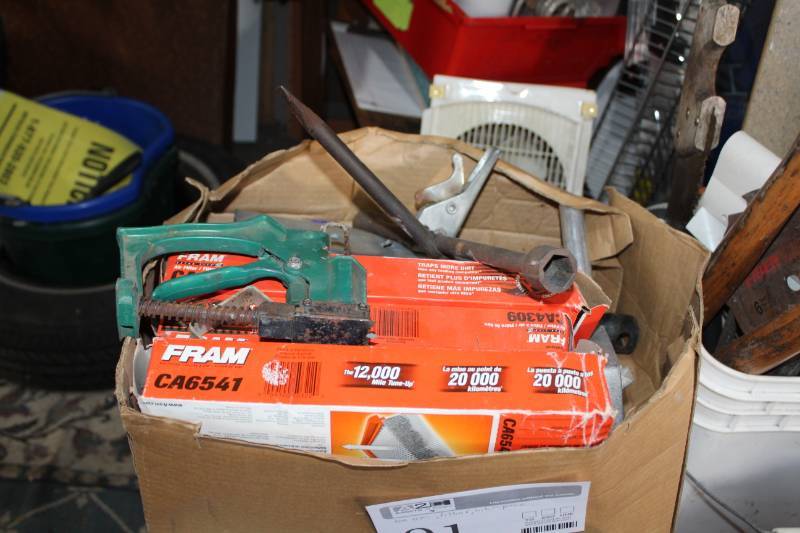 lot 91 image: Fram Air Filters, Tire Iron, Hitch Section