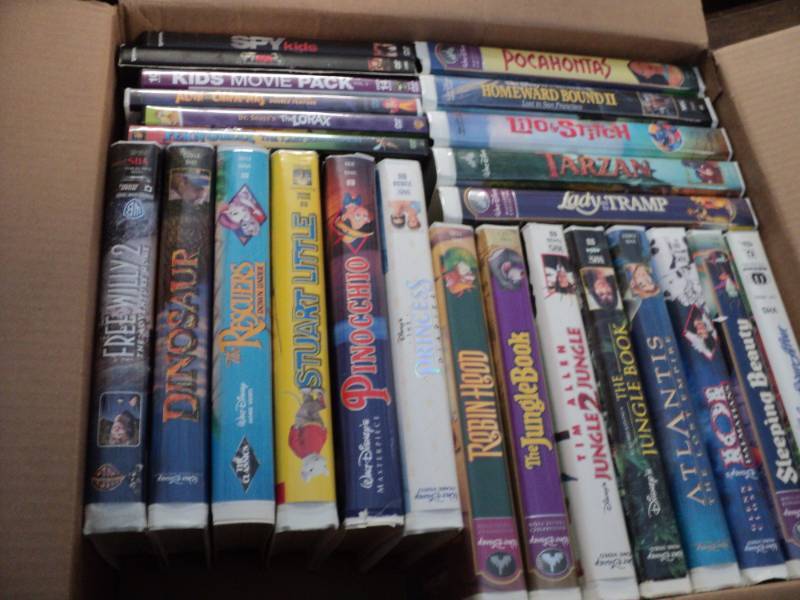 lot 40 image: Box of VCR and DVDs...