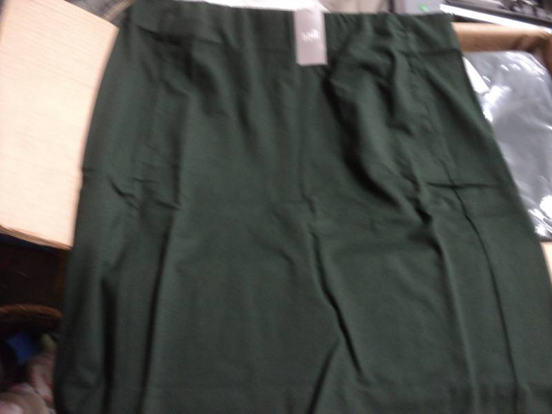 lot 101 image: Lot of 40 J. Hill Hunter green Skir...