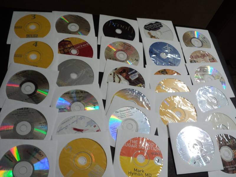 lot 146 image: 100 CDs and DVDs and Games...