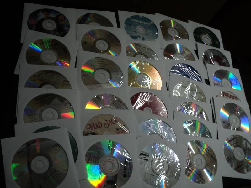 lot 147 image: 100 CDs and DVDs and Games...