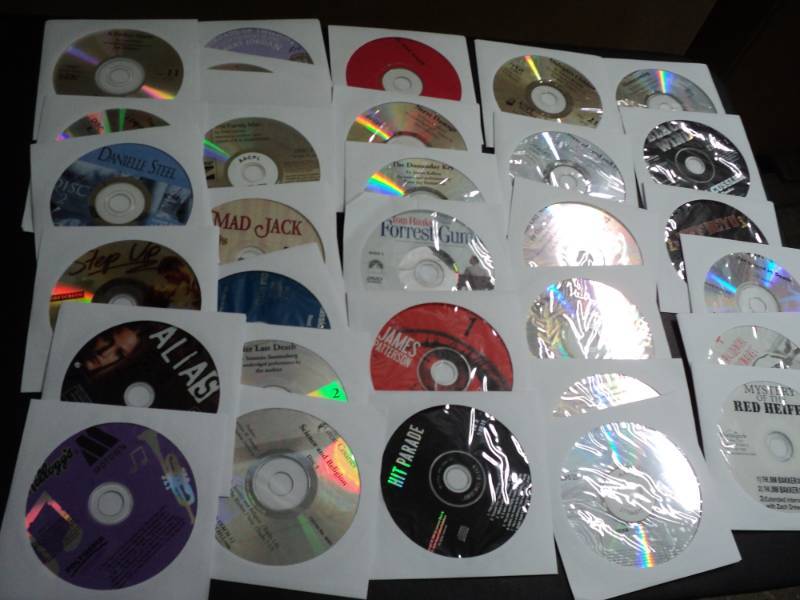 lot 150 image: 100 CDs and DVDs and Games...